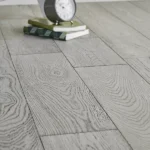 Close-up of gray wood floor with detailed grain.