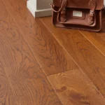 Close-up of honey-colored oak flooring planks.