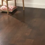 Dark oak engineered wood flooring in a bright room