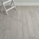 Light gray oak-style laminate flooring planks