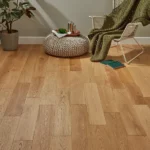 Light oak wood floor in a cozy, styled living room