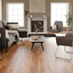 Modern living room featuring light brown wood flooring