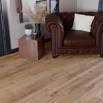 Modern living room with light oak flooring and chair
