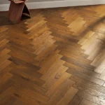 Oak parquet flooring in a herringbone pattern