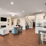 Open-concept living room with oak hardwood floors