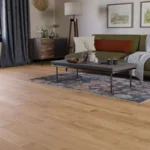 Open living room featuring light oak wood floors