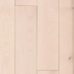 Top-down view of light maple wood floor planks