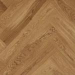 Top-down view of light oak herringbone wood planks