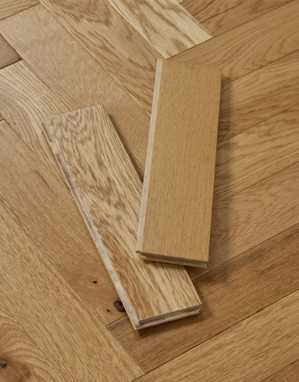 Two oak parquet blocks on a herringbone floor.