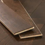 Two tongue-and-groove dark oak flooring sample