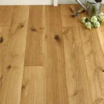 Wide view of natural oak floor with garden tools